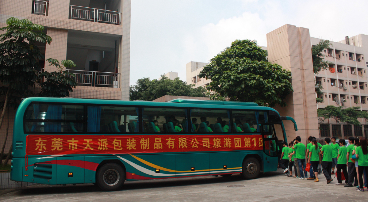 Tin box factory's staff get in line onboard the buses.